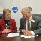 NWU President Darrin Good and York University Provost Shannon Leiden sign agreement for Masters of Athletic Training program. 